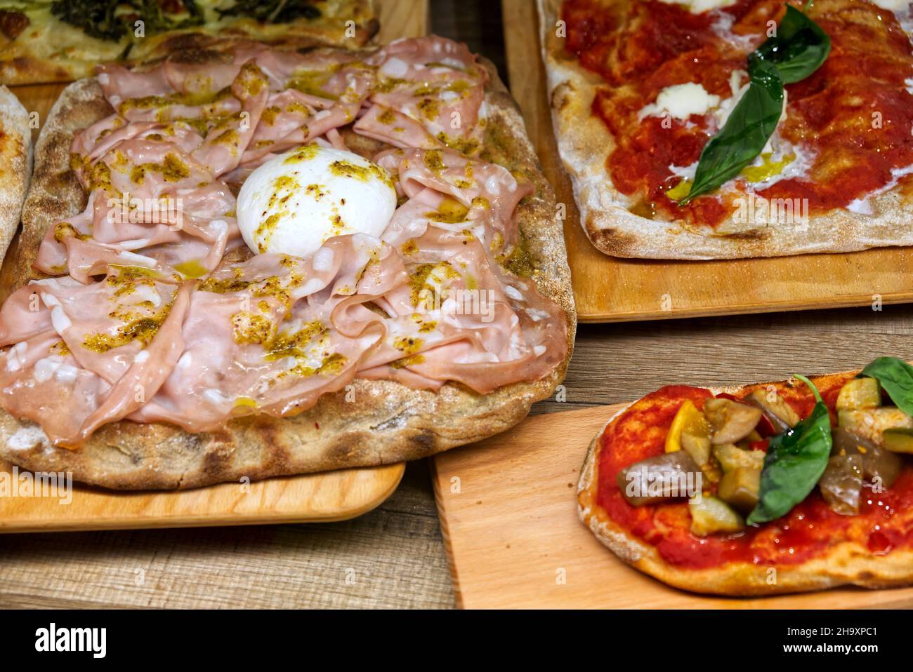 exhibition of Italian focaccia with mortadella, buffalo mozzarella and