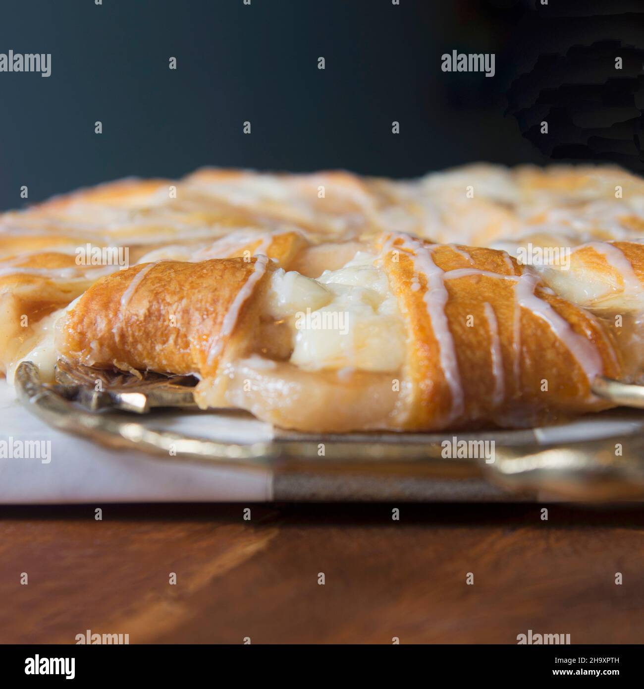 A puff pastry ring with apple, fresh cheese and caramel Stock Photo Alamy