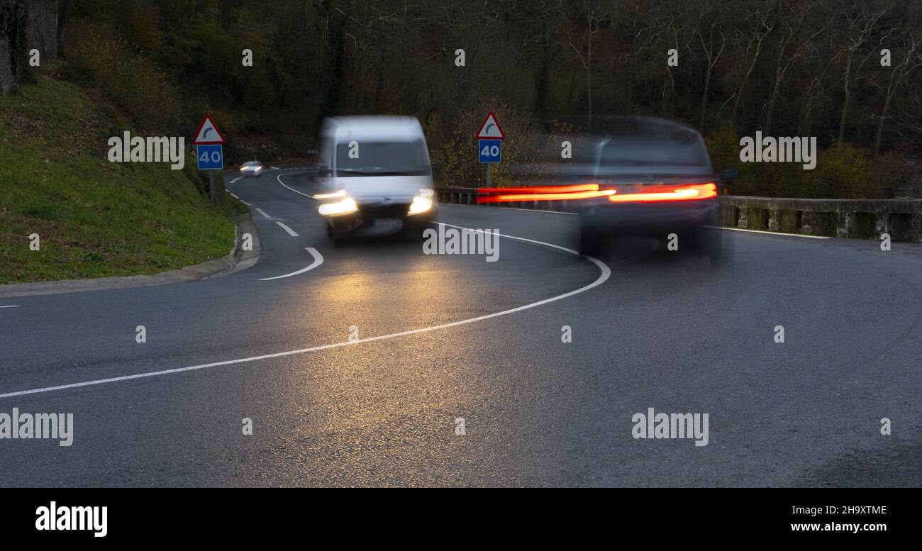 curvy road and car lights Stock Photo Alamy