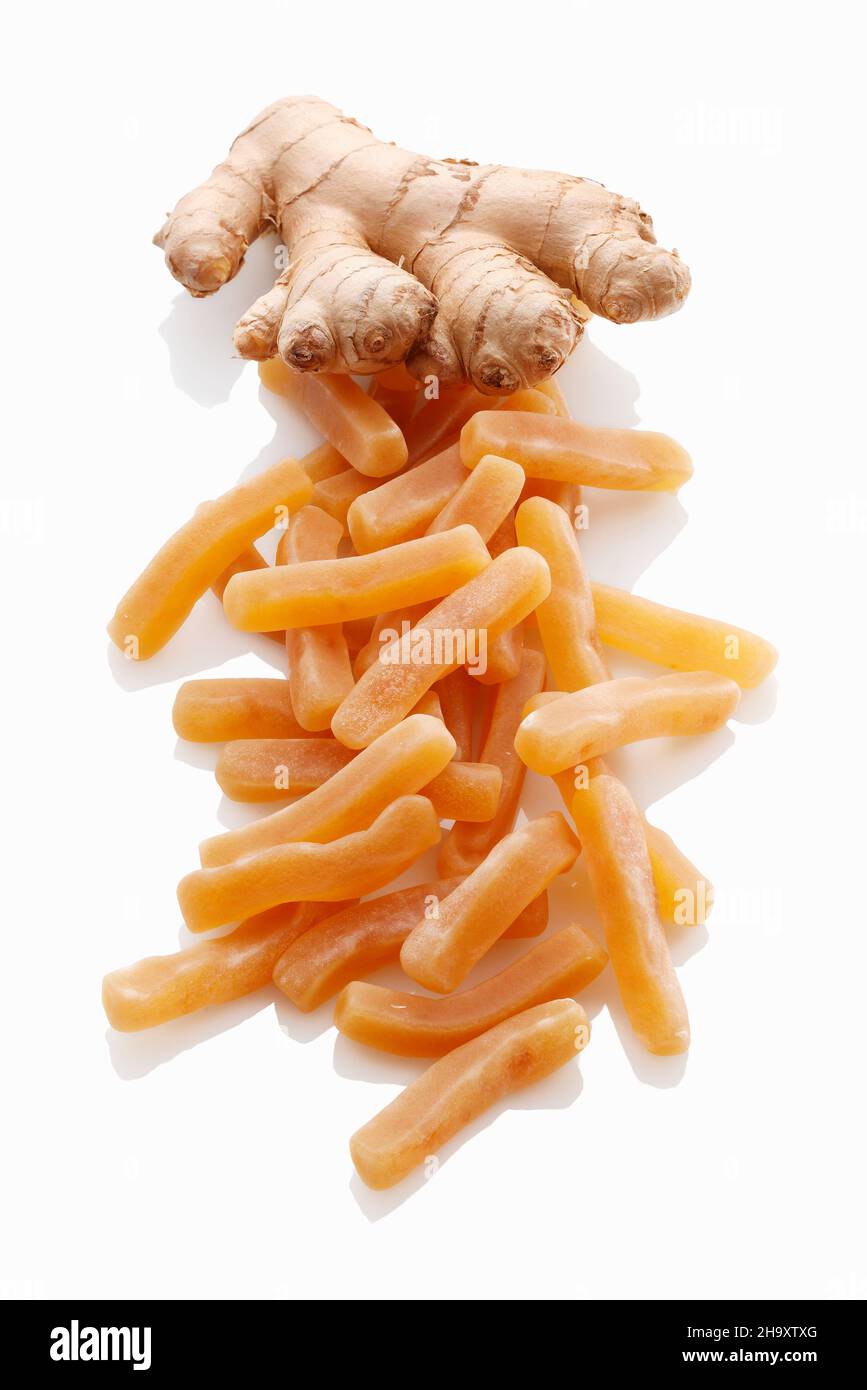 Ginger fruit gums and a fresh ginger root Stock Photo Alamy