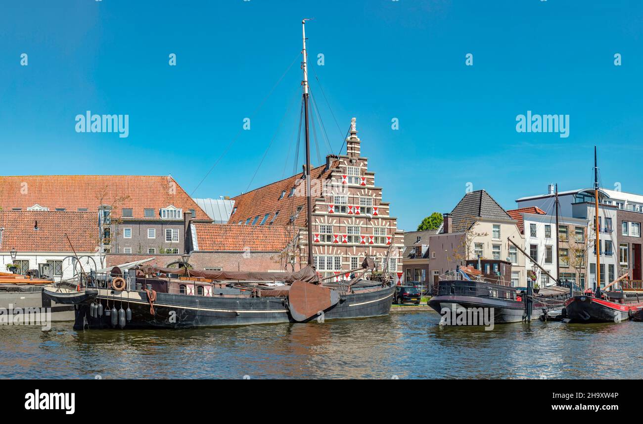 Stepped gable house and ships in the river Leidse rijn Stock Photo - Alamy