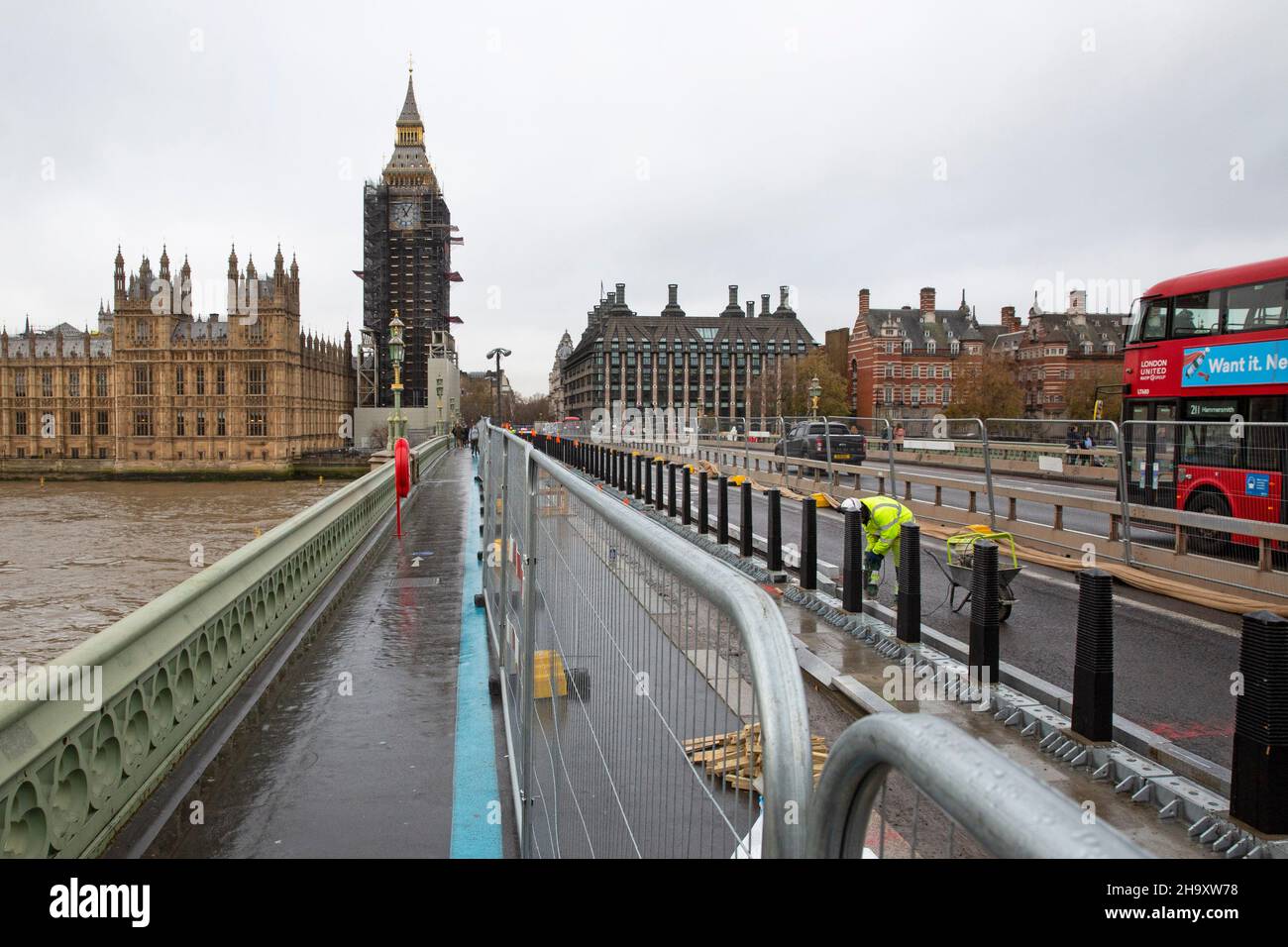 Construction Workers install cycle lanes on Westminster Bridge, London, United Kingdom Stock Photo