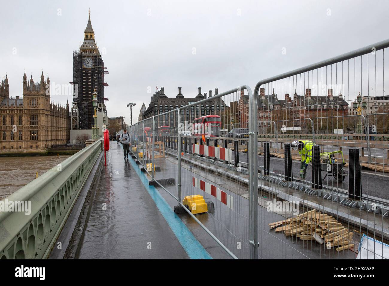 Construction Workers install cycle lanes on Westminster Bridge, London, United Kingdom Stock Photo