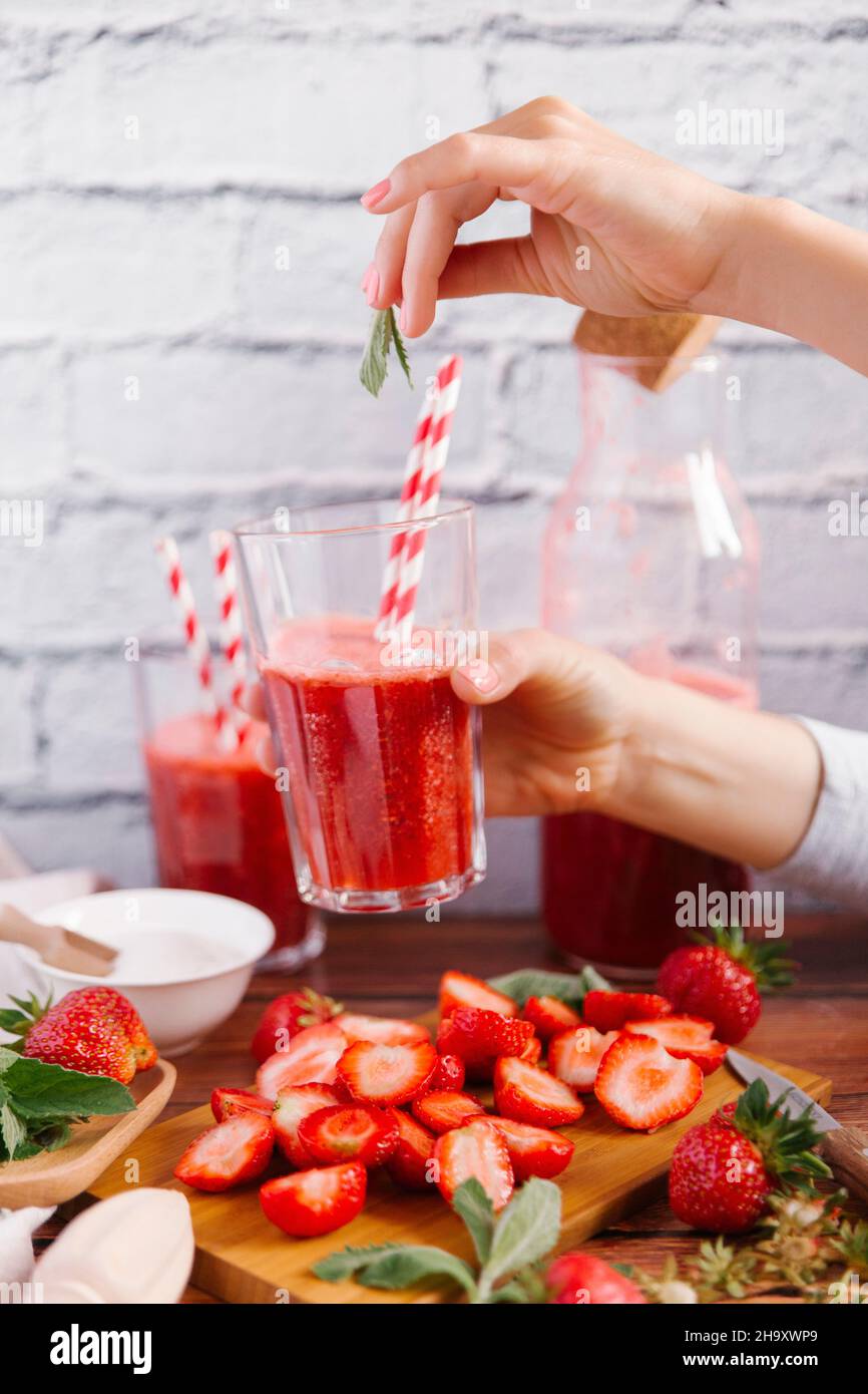 Strawberry smoothies and mint leaves in glasses Stock Photo Alamy