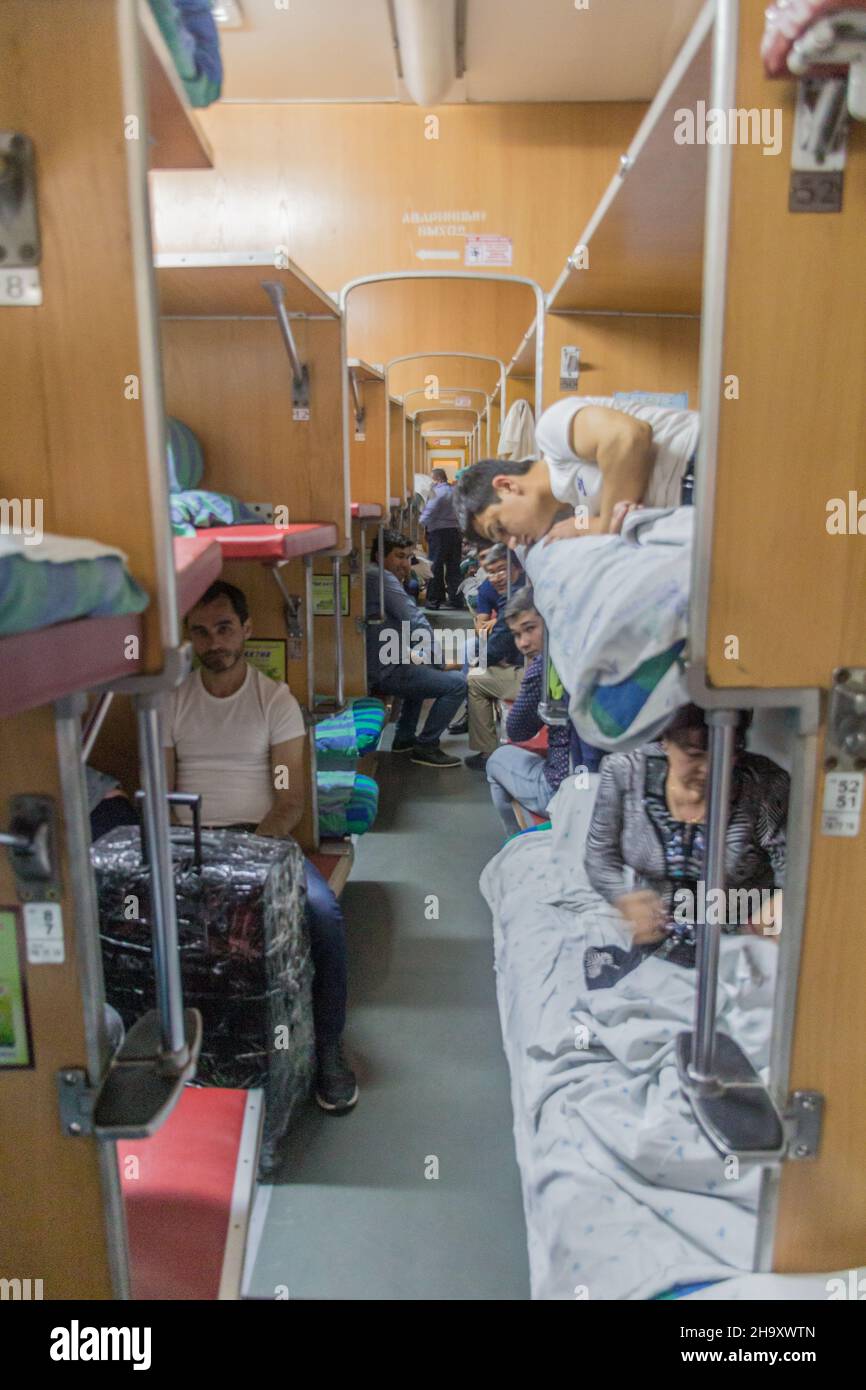 BUKHARA, UZBEKISTAN - MAY 2, 2018: Interior of Platzkart class train coach in Uzbekistan Stock Photo