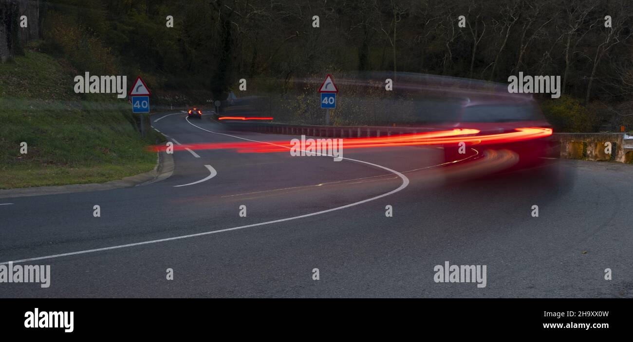 curvy road and car lights Stock Photo Alamy