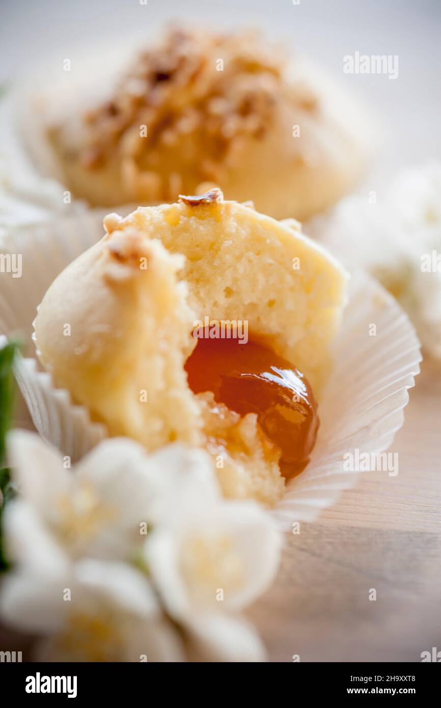 Muffins with chopped almonds and and apricots core Stock Photo