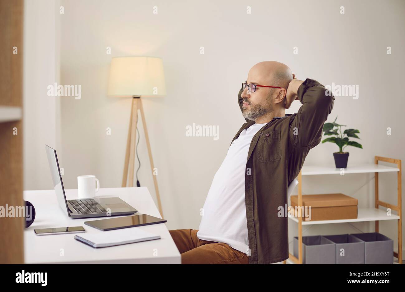 Tired man sleep at desk at home office Stock Photo Alamy