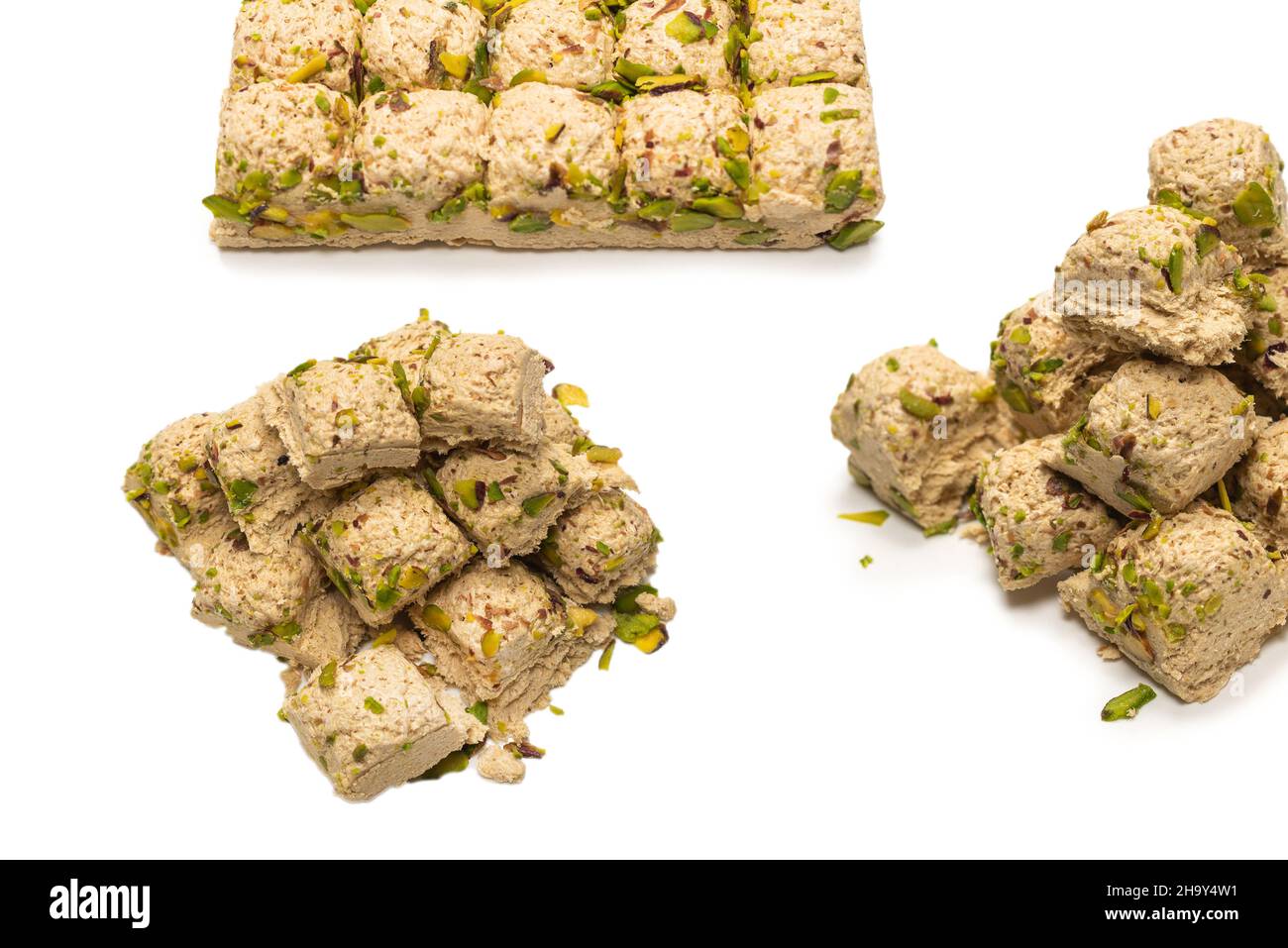 Halva with pistachios isolated on white background. Stock Photo