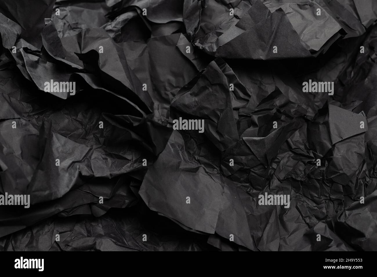 Abstract black paper texture background. Top view. Copy space. Stock Photo