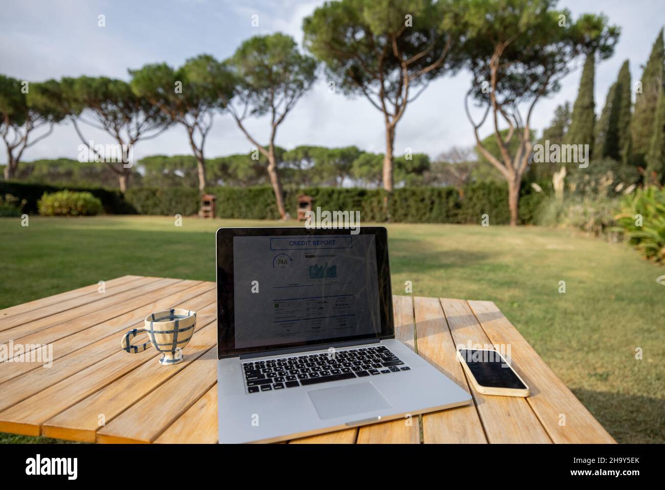 Workplace with laptop computer outdoors Stock Photo - Alamy