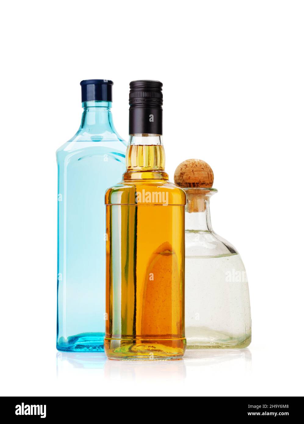 Various hard liquor bottles. Gin, vodka, tequila and whiskey. Isolated