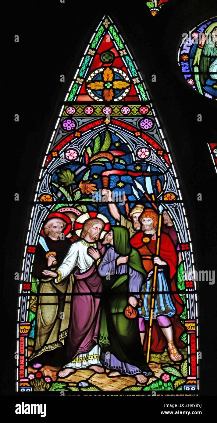 A stained glass window by Frederick Preedy depicting The Betrayal of Jesus by Juda Iscariot, St Mary's Church, Old Hunstanton, Norfolk Stock Photo