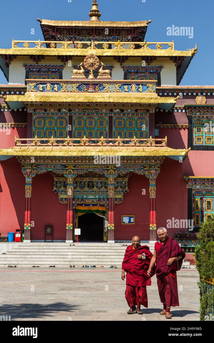 Two Buddhist monks in front of the main temple of the Sechen Tennyi Dargyeling Monastery in Kathmandu, Nepal. Stock Photo