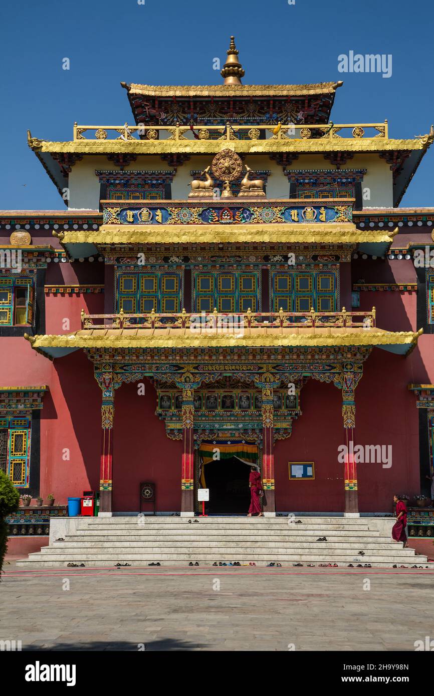 A Buddhist monk enters the main temple of the Sechen Tennyi Dargyeling Monastery in Kathmandu, Nepal. Stock Photo