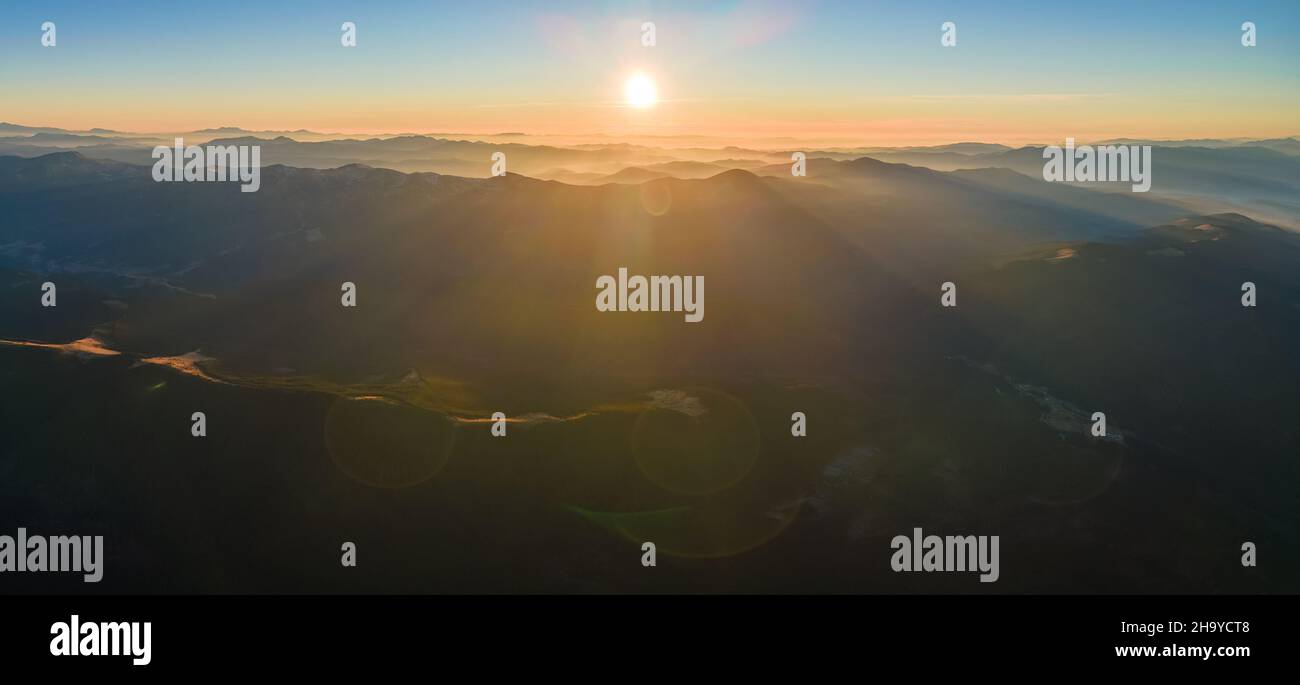 Beautiful mountain panoramic landscape with hazy peaks and foggy valley ...