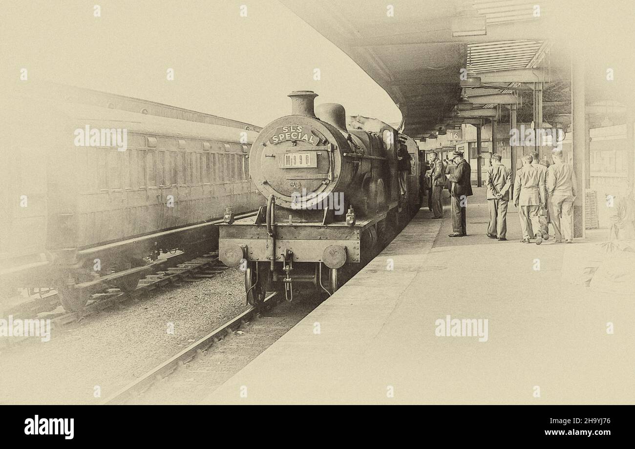 The image from a scanned monochrome negative is of Stephenson Locomotive Special at York Railway Station in North Yorkshire as it was in June 1956 with the steam train 40928 standing idle waiting for passengers Stock Photo