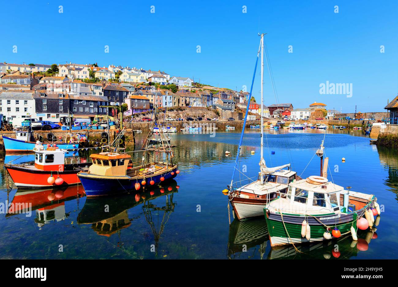 Mevagissey Cornwall fishing boats in harbour colourful English coast scene Stock Photo