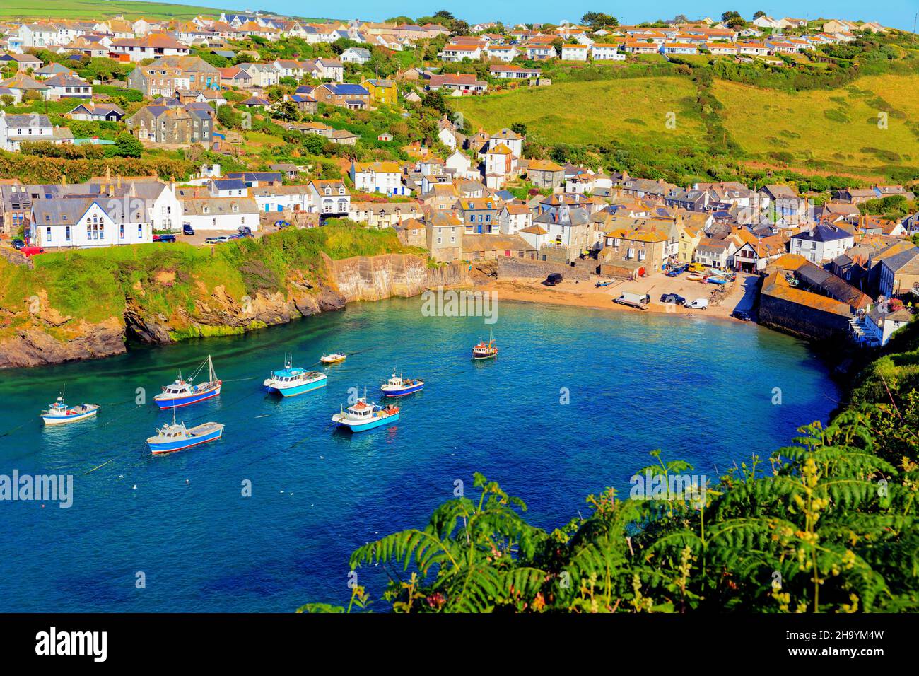 Port Isaac Cornwall Cornish harbour and fishing village England UK with blue sea and sky Stock Photo
