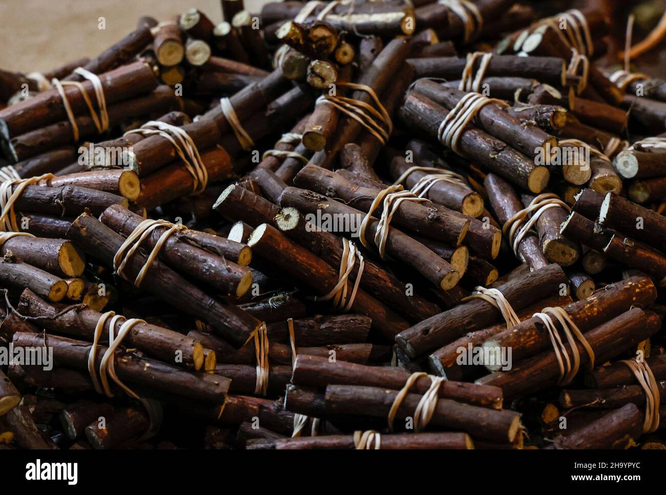 Licorice roots for sale on a market stall in Vic, Catalonia, Spain Stock Photo