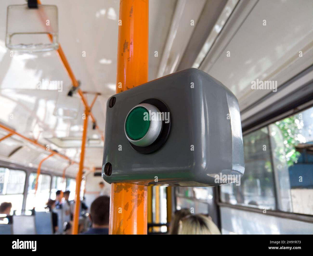 Stop button in city tram. Button open door request in public transport ...