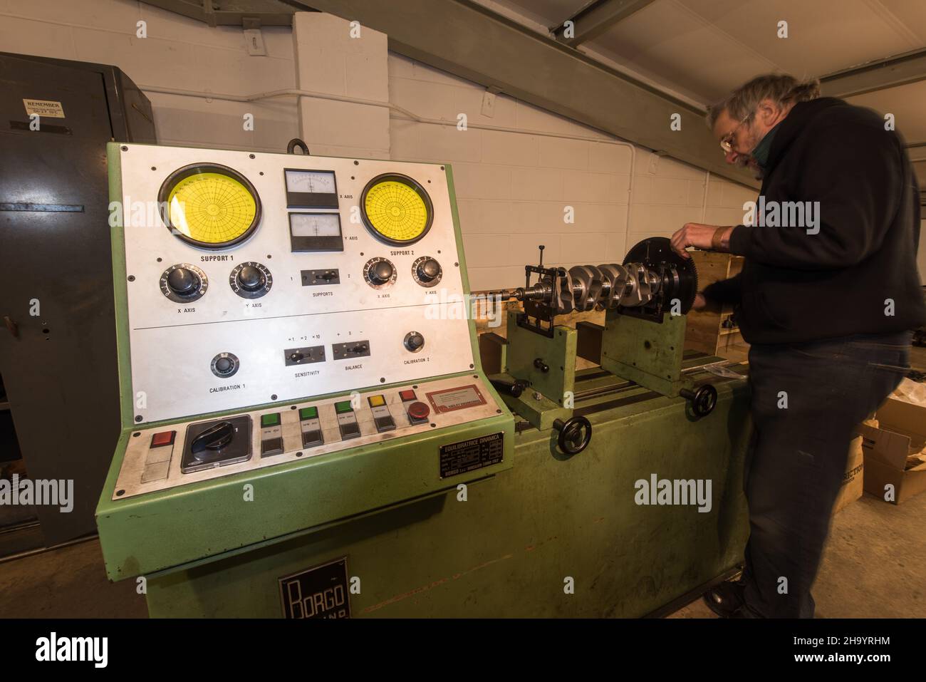 Balancing car engine flywheel Stock Photo - Alamy