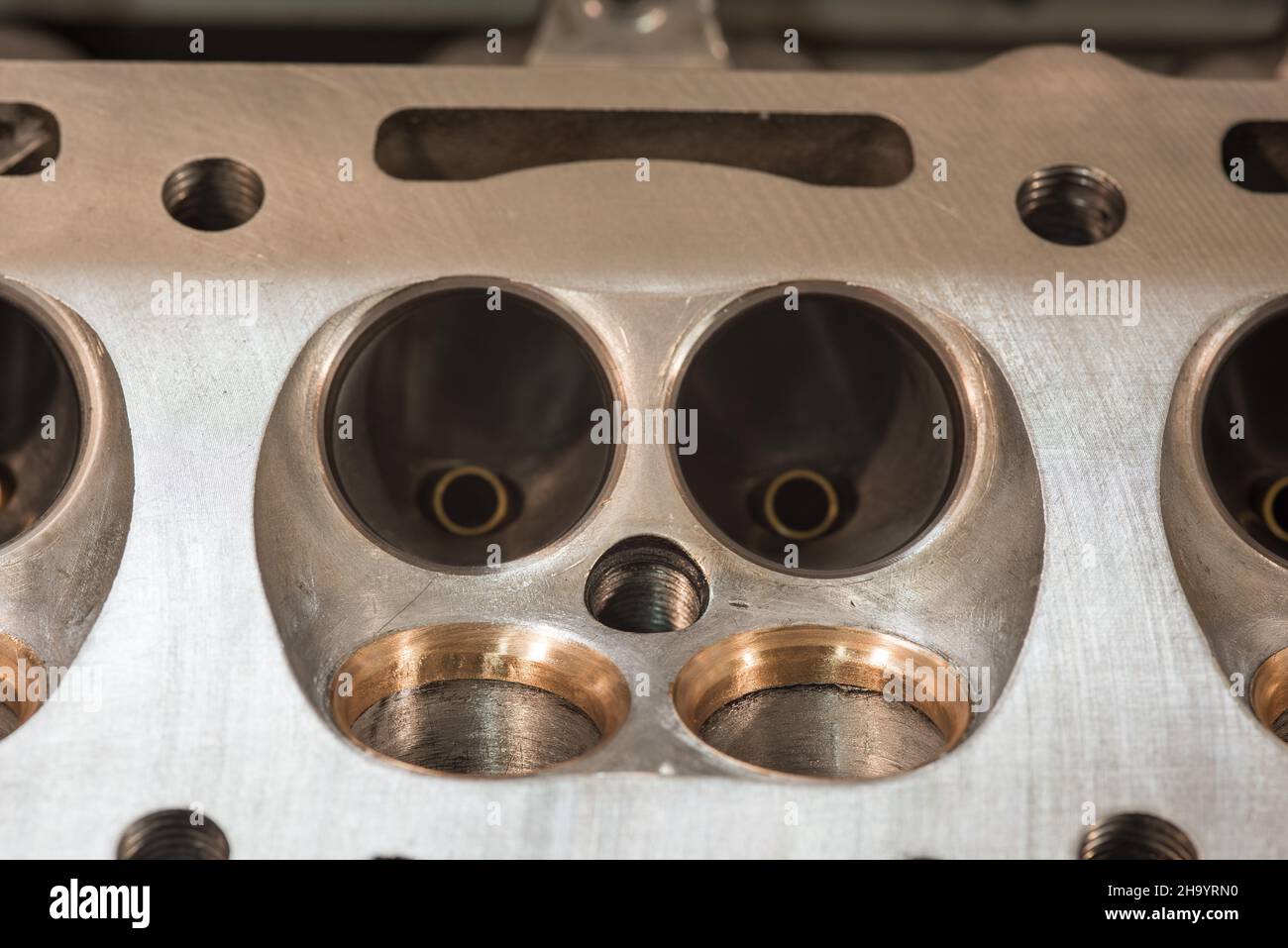 Grinding valve seats on car engine cylinder block Stock Photo Alamy
