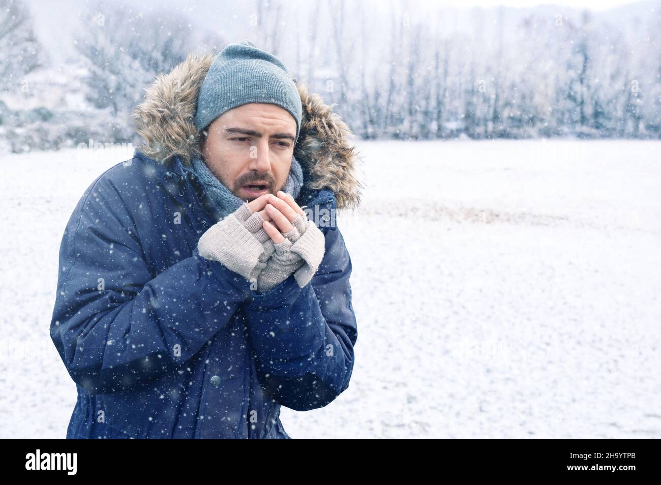 One man suffering and shivering because of cold weather Stock Photo Alamy