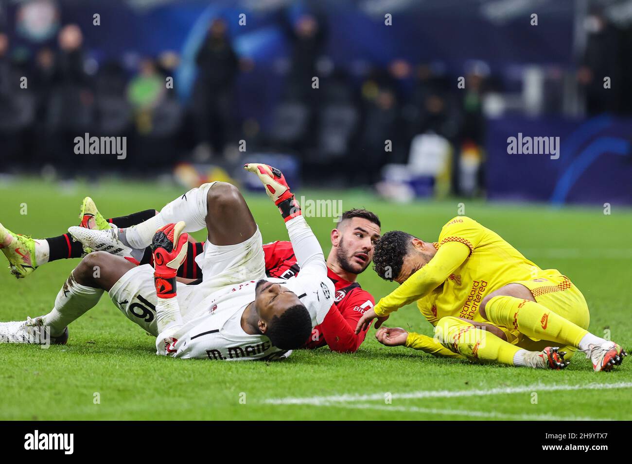 Theo Hernandez of AC Milan injured with Mike Maignan of AC Milan and