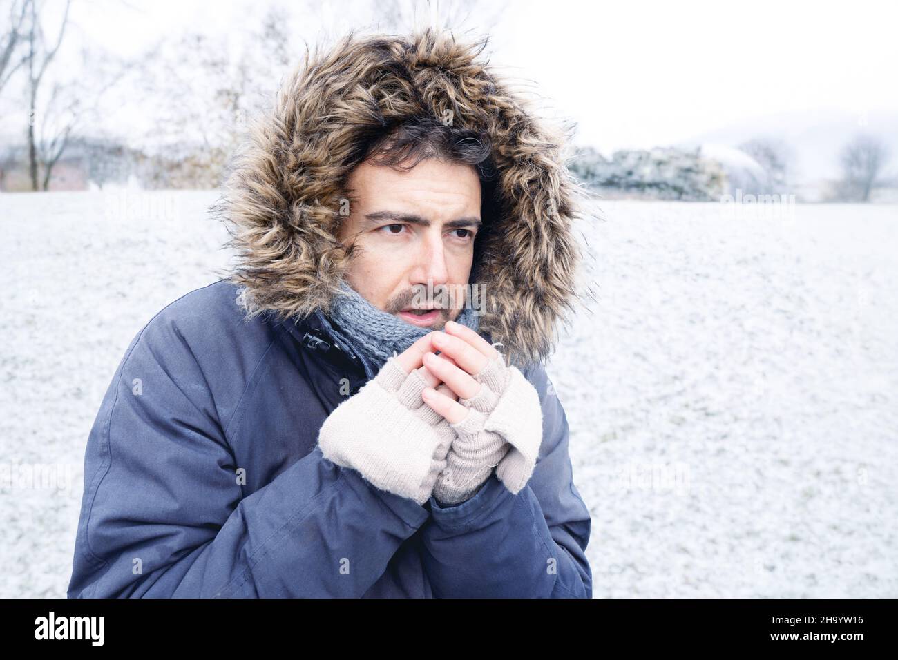 One man suffering and shivering because of cold weather Stock Photo Alamy