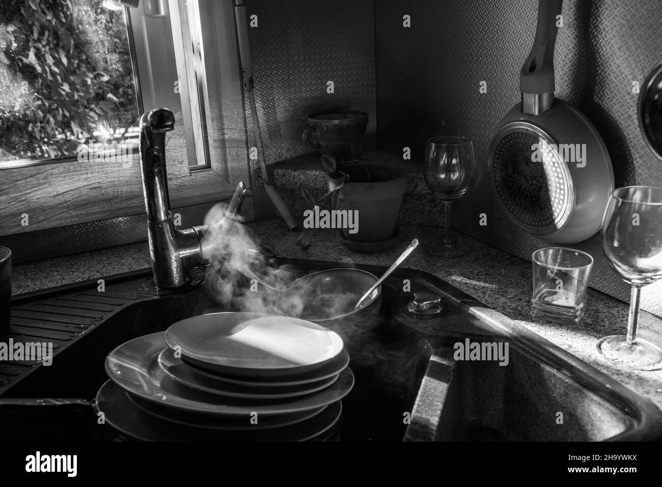 Cleaning dirty dishes Black and White Stock Photos & Images - Alamy