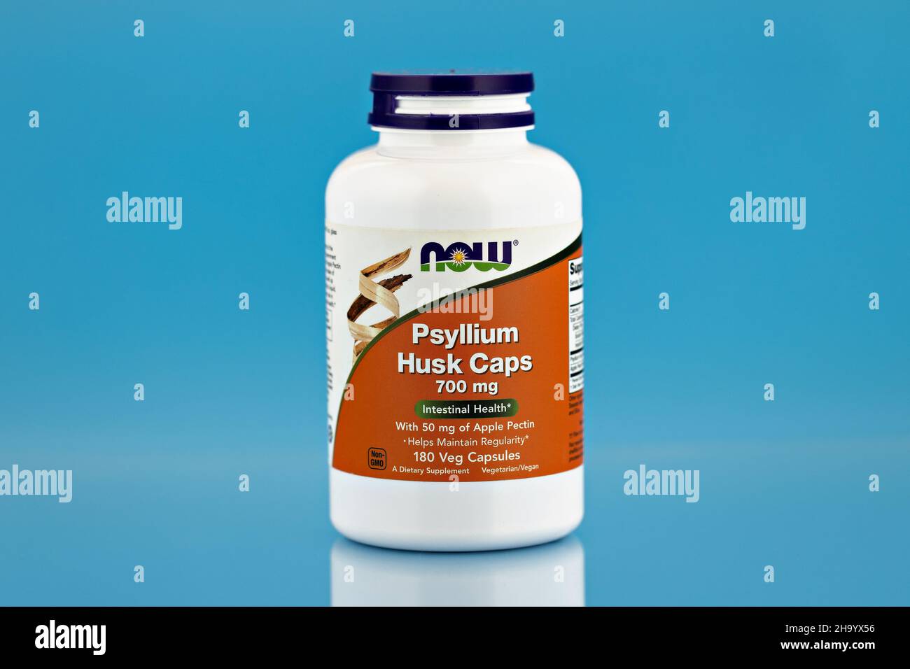 psyllium husk capsules in the jar. dietary supplement editorial photo