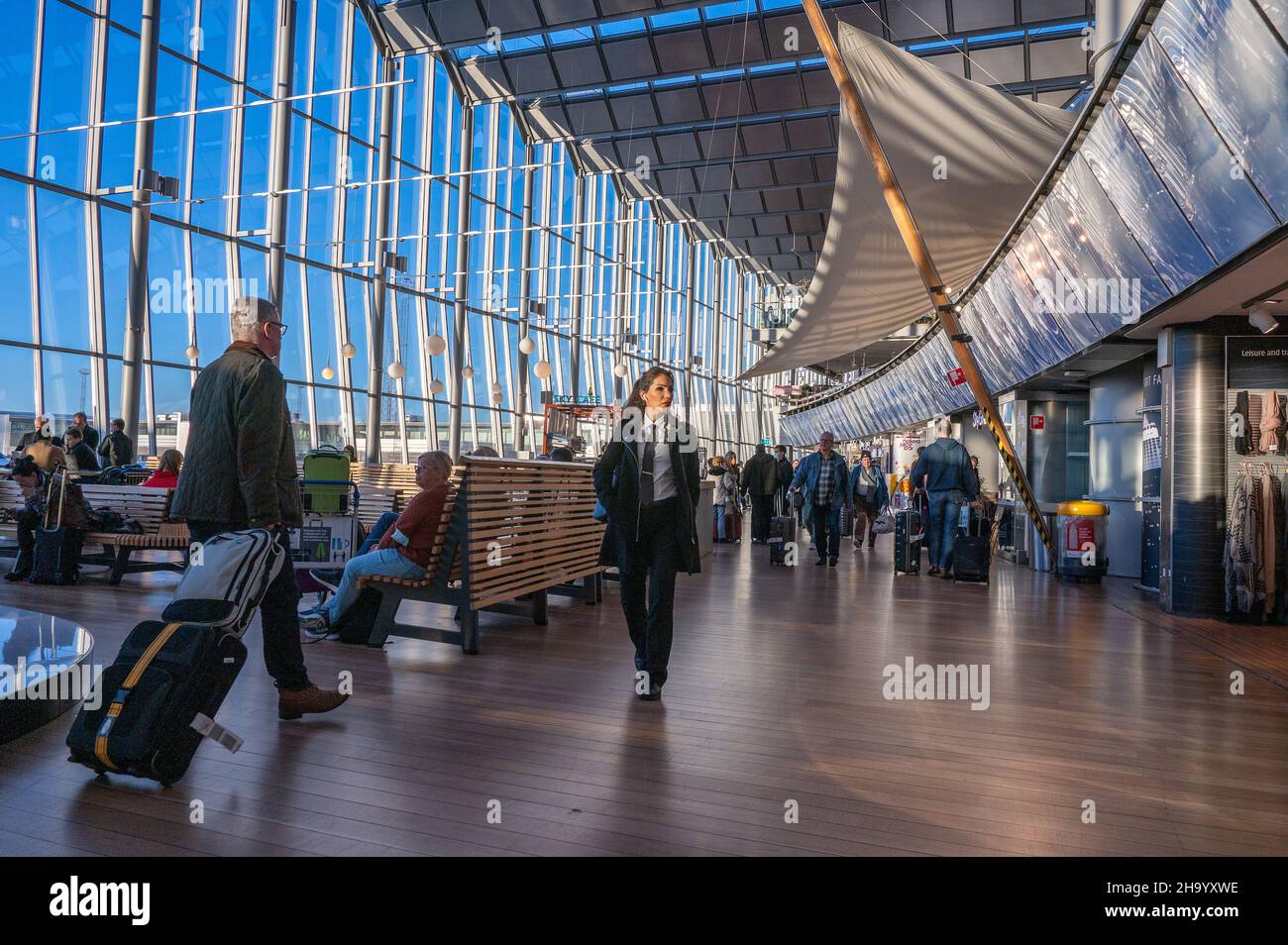 Travelers at Sky City between the international and domestic terminal at Arlanda Airport in Stockholm. This is the busiest airport in Sweden. Stock Photo