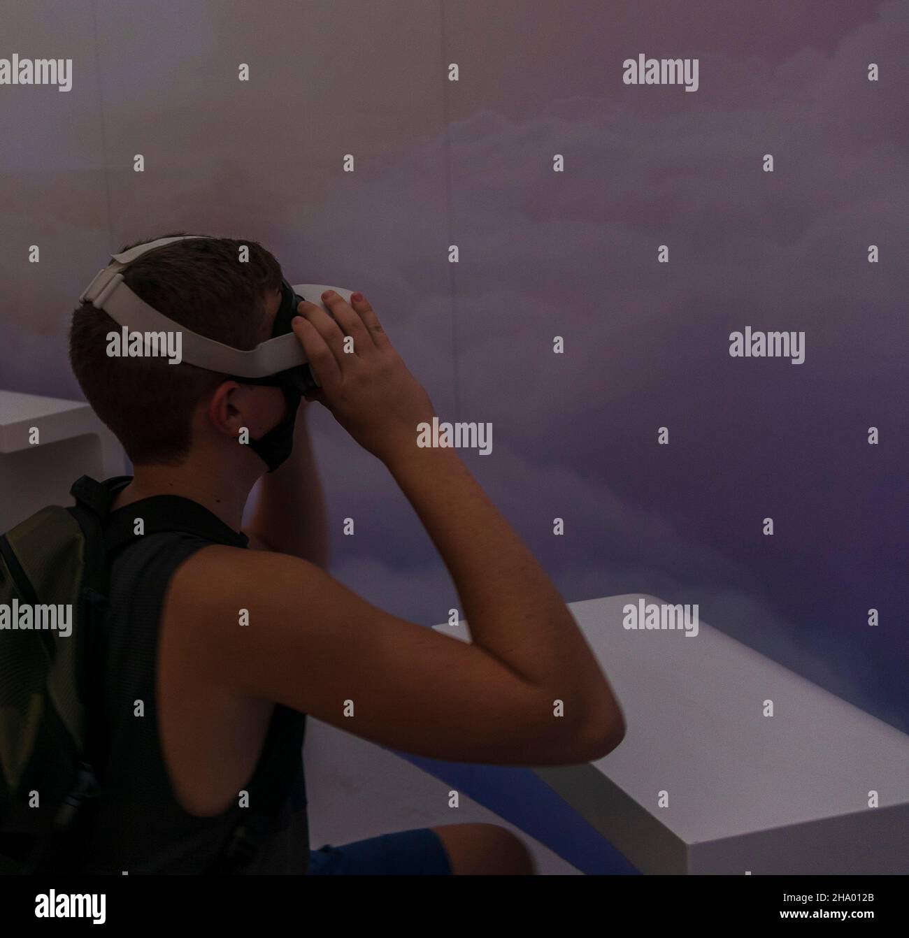 Teenage boy in the mask with VR set Stock Photo Alamy