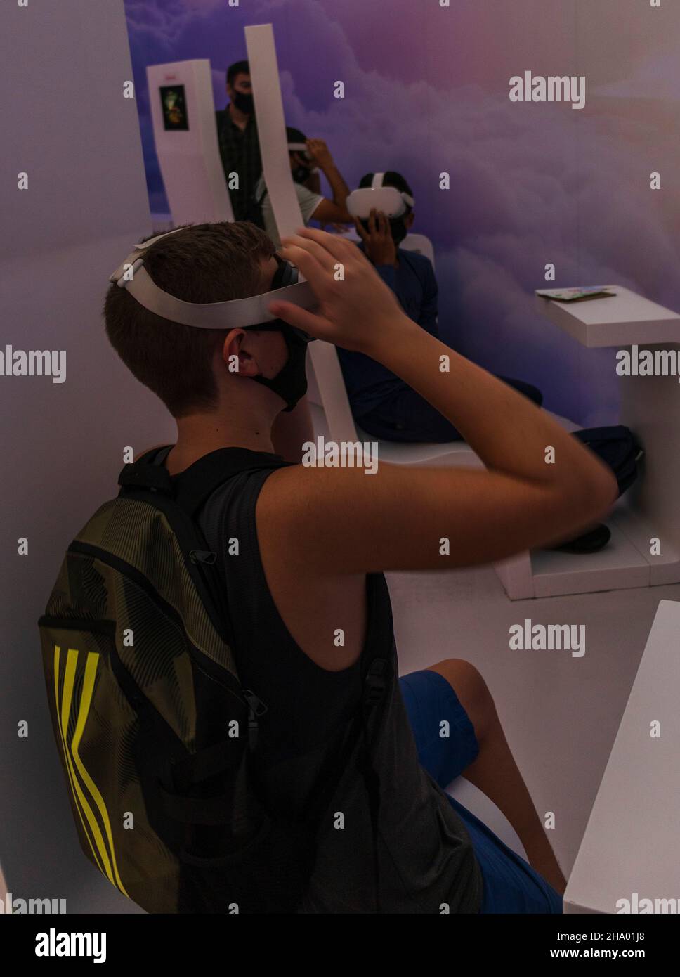 Teenage boy in the mask with VR set Stock Photo Alamy