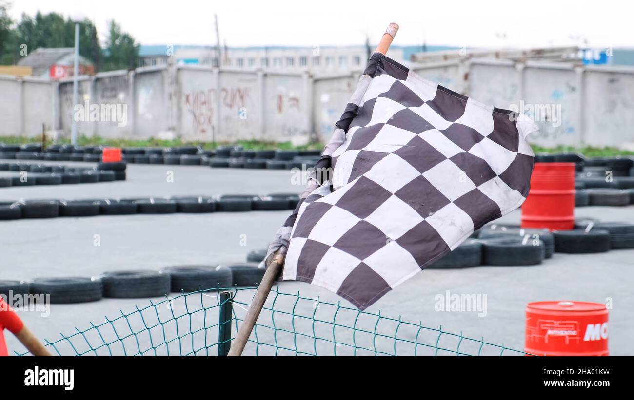 Closeup view of red and checkered start and finish flags on the