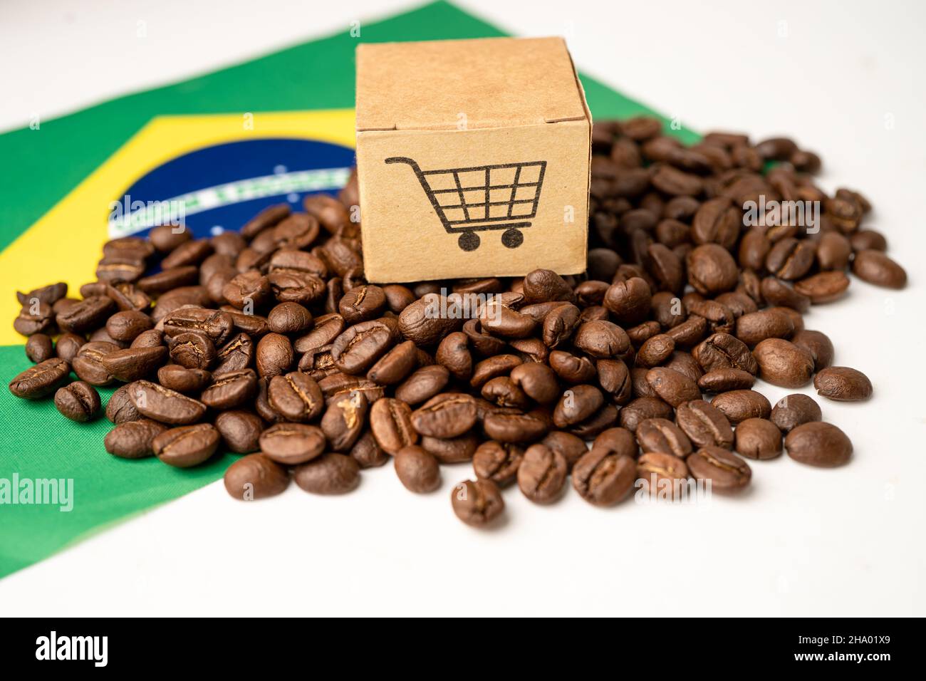 Coffee beans on Brazil flag; import export drink food concept Stock