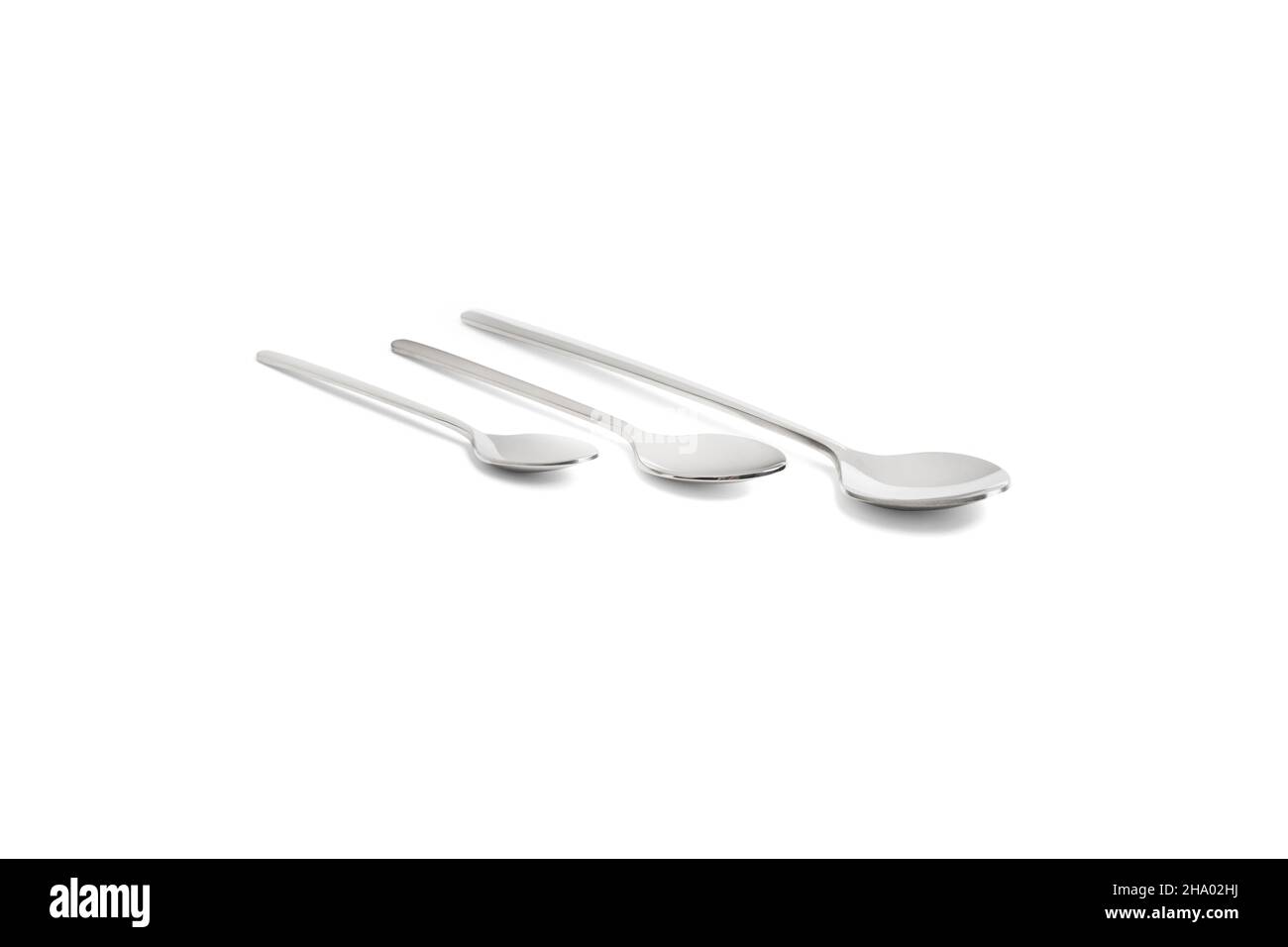 Clean shiny metal spoon isolated on white. Stainless steel small