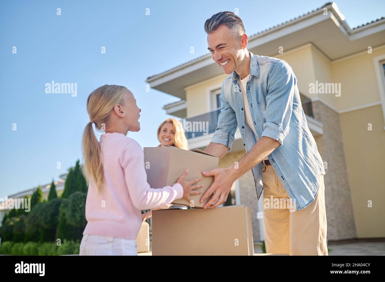 Family moving to a new house Stock Photo