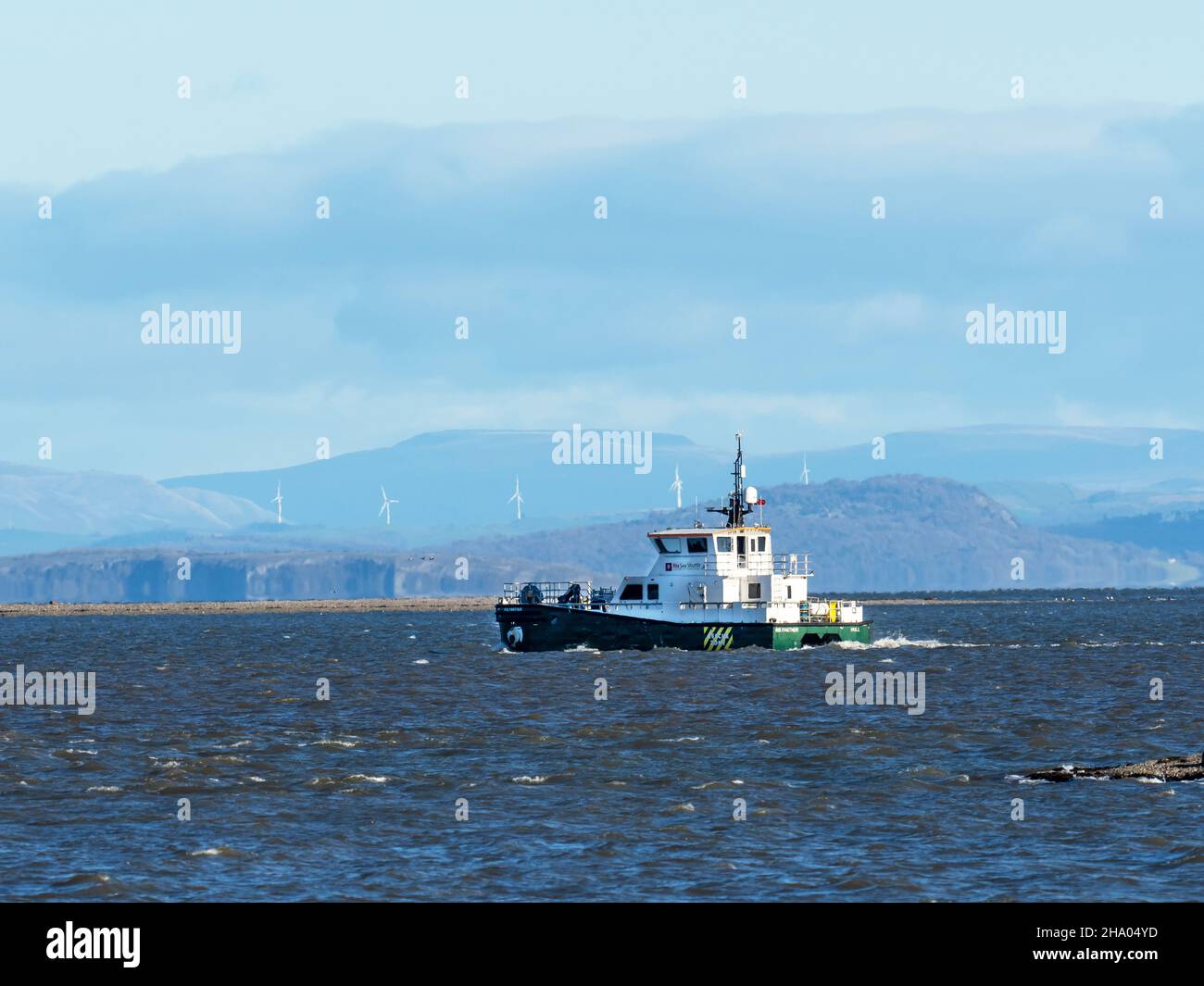 A boat for servicing the Walney offshore windfarm off Walney Island, Cumbria, UK. Stock Photo