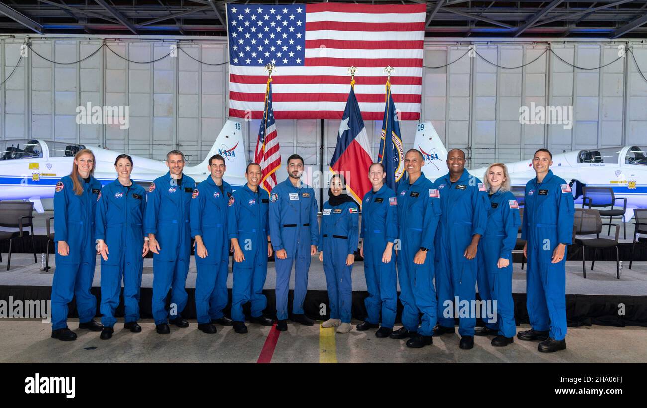 Houston, United States. 06 December, 2021. NASA astronaut candidates stand for a group photo during an event announcing the new class of 10 candidates at Ellington Field on the Johnson Space Center, December 6, 2021 in Houston, Texas. Standing from left to right are: Nichole Ayers, Christina Birch, Luke Delaney, Andre Douglas, Christopher Williams, Jessica Wittner, Anil Menon, Andre Douglas, Deniz Burnham and Marcos Berrios.  Credit: Robert Markowitz/NASA/Alamy Live News Stock Photo