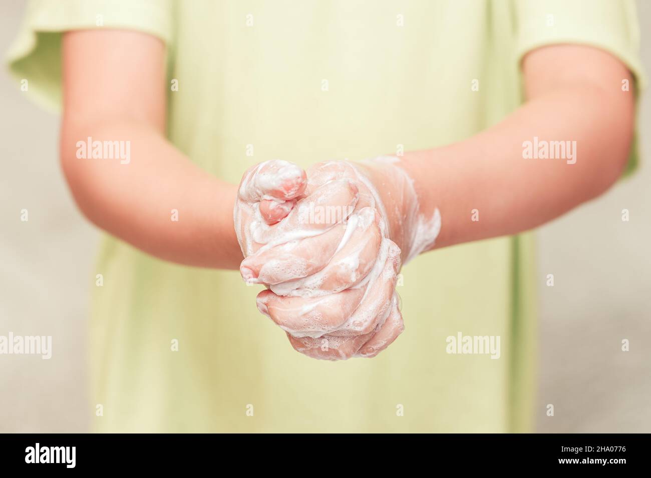 Front view on kid hands with soap foam Stock Photo Alamy