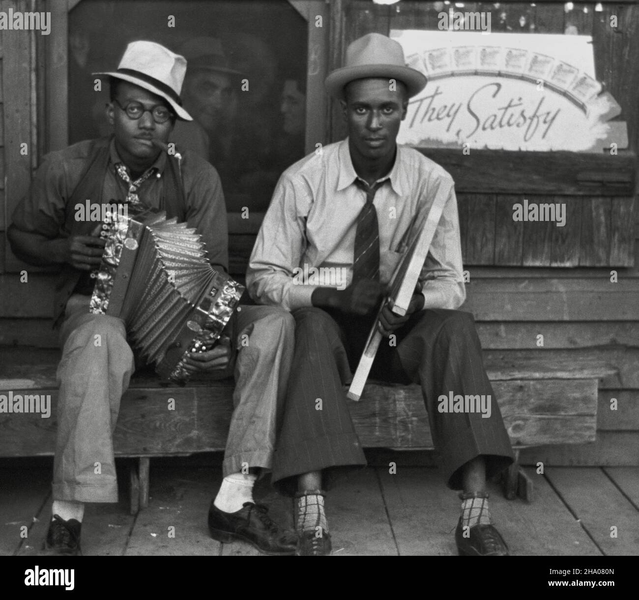 Russell Lee photograph of african-american musicians playing accordion and  washboard in front of store, near New Iberia, Louisiana, USA - 1938 Stock  Photo - Alamy