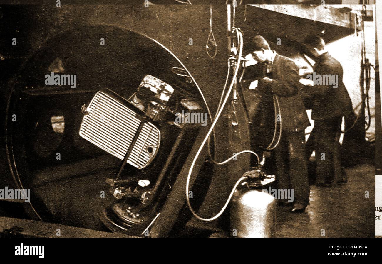 Spraying & finishing a Morris motor Car 1934. Stock Photo
