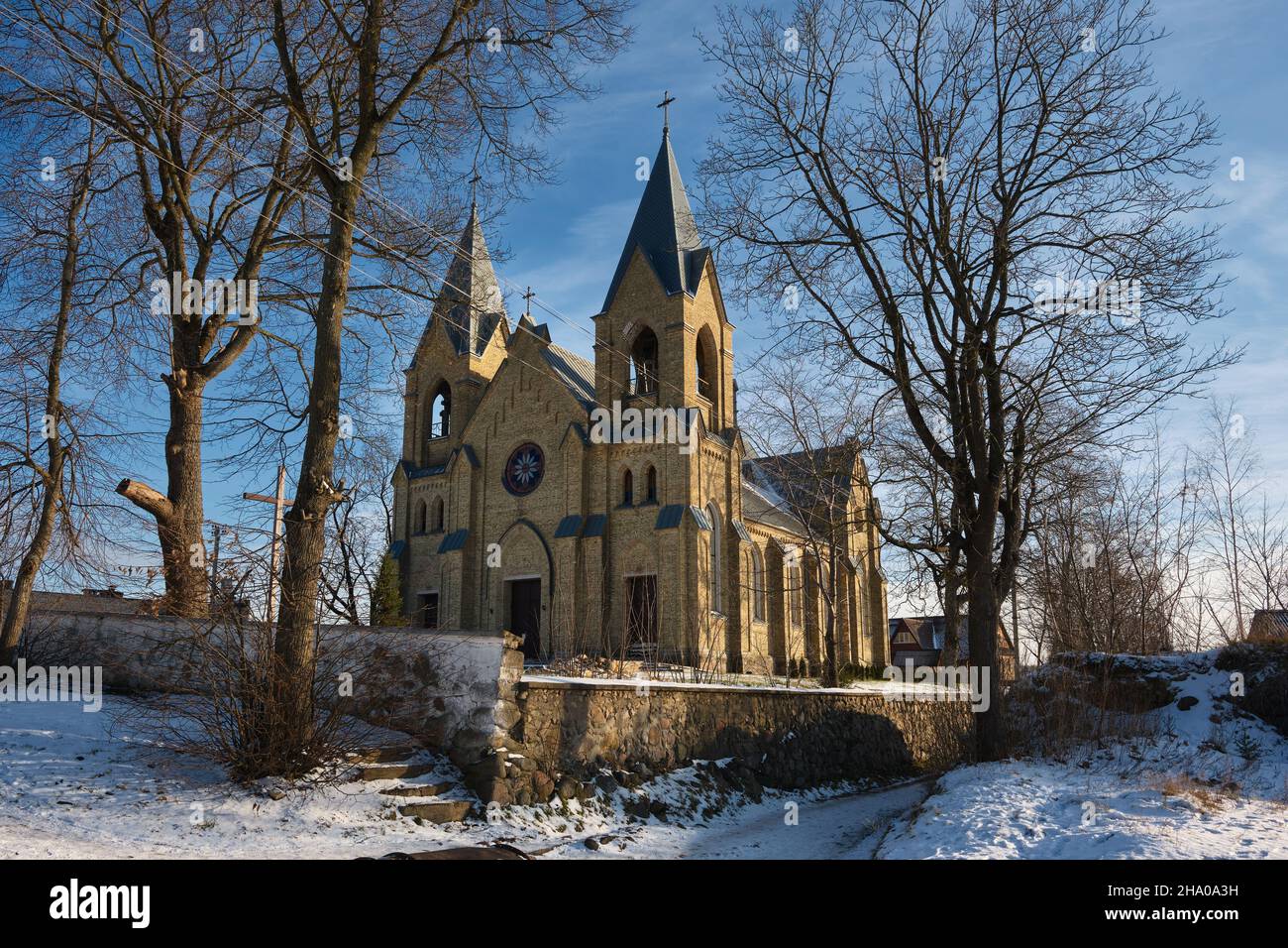 Old ancient church of Our Lady of the Holy Rosary and St. Dominic in Rakov, Minsk region, Belarus. View of the church in winter. Stock Photo