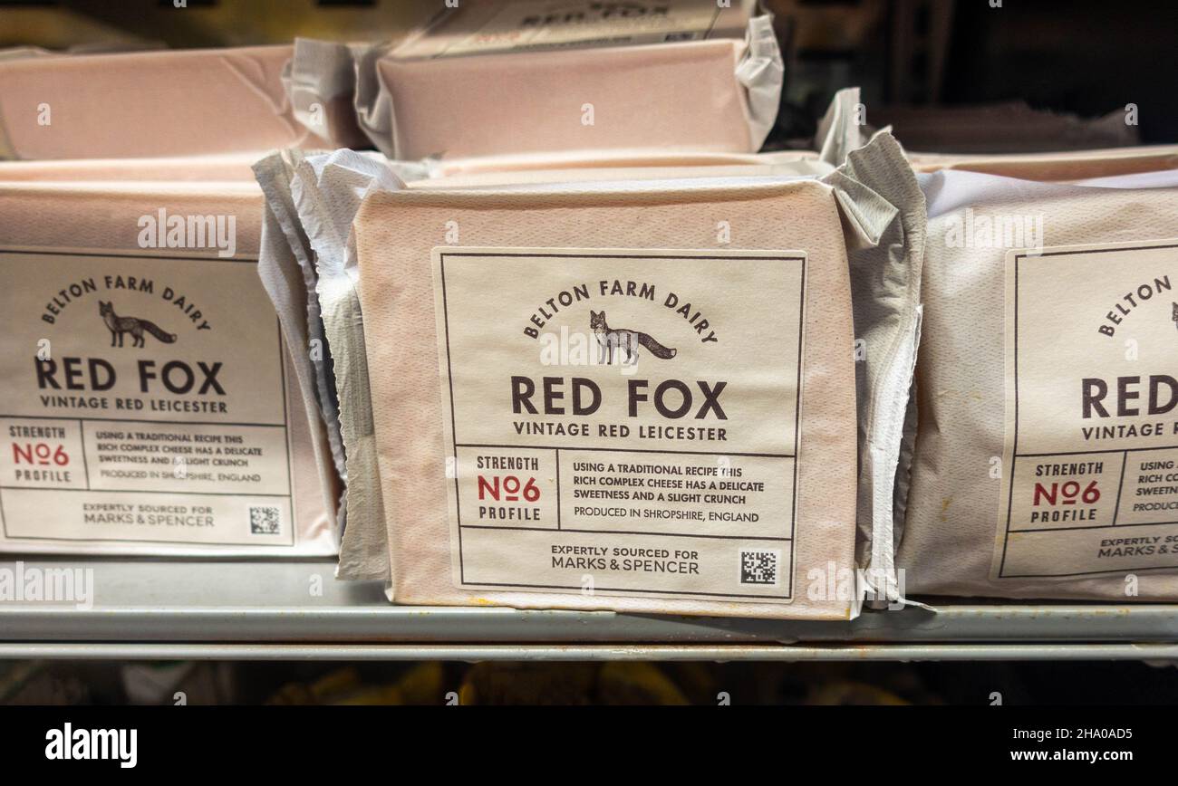 Selections of packaged Red Fox vintage Red Leicester cheese on a shelf
