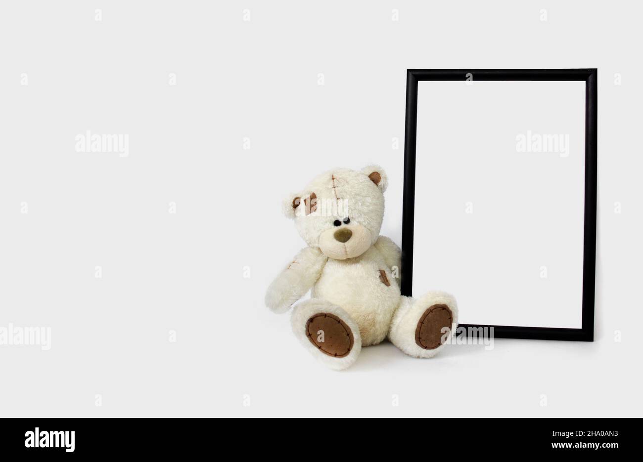 White soft toy bear with vertical frame mockup with copy space. Empty space. Stock Photo