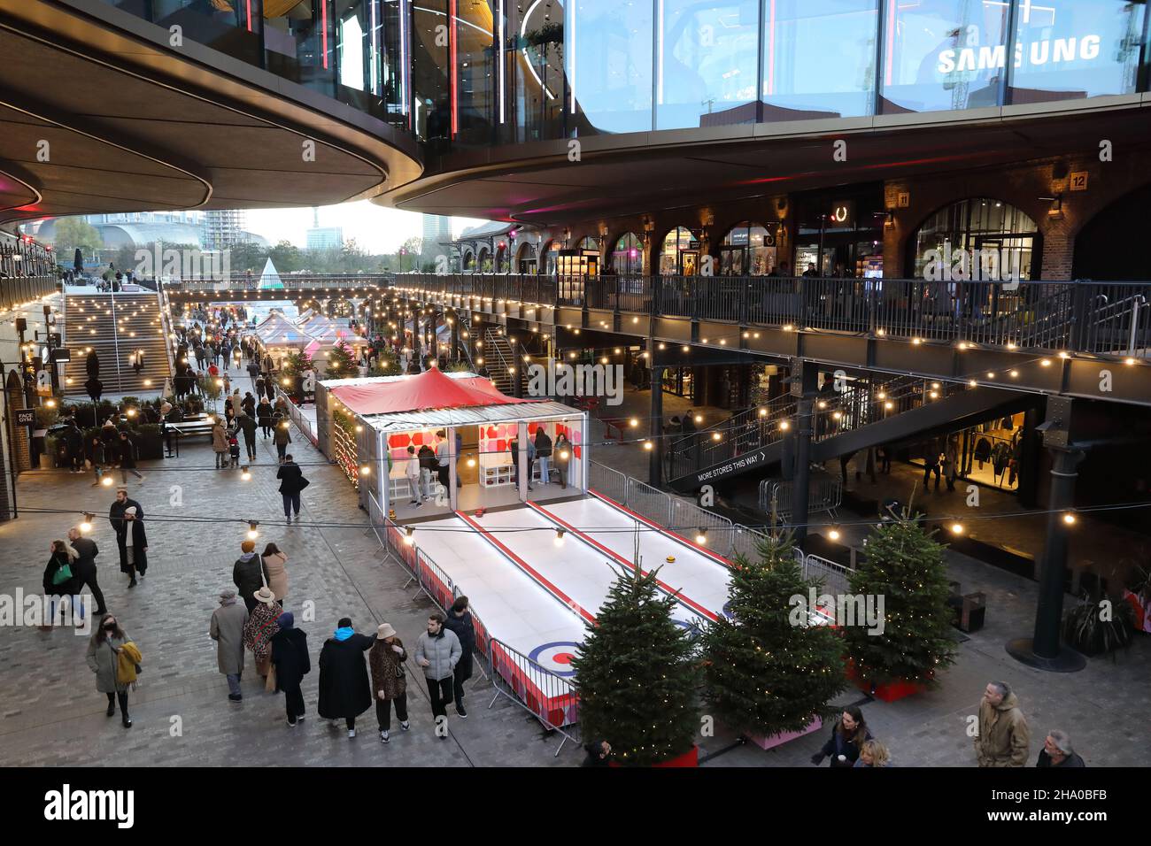 Christmas shopping at Coal Drops Yard, at Kings Cross, north London, UK Stock Photo