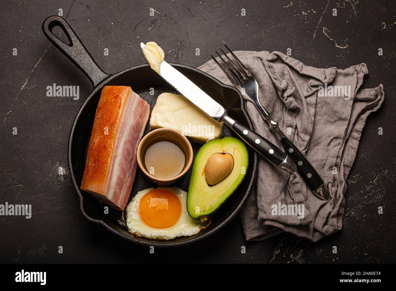 Foods for keto diet in cast iron pan on dark background Stock Photo Alamy