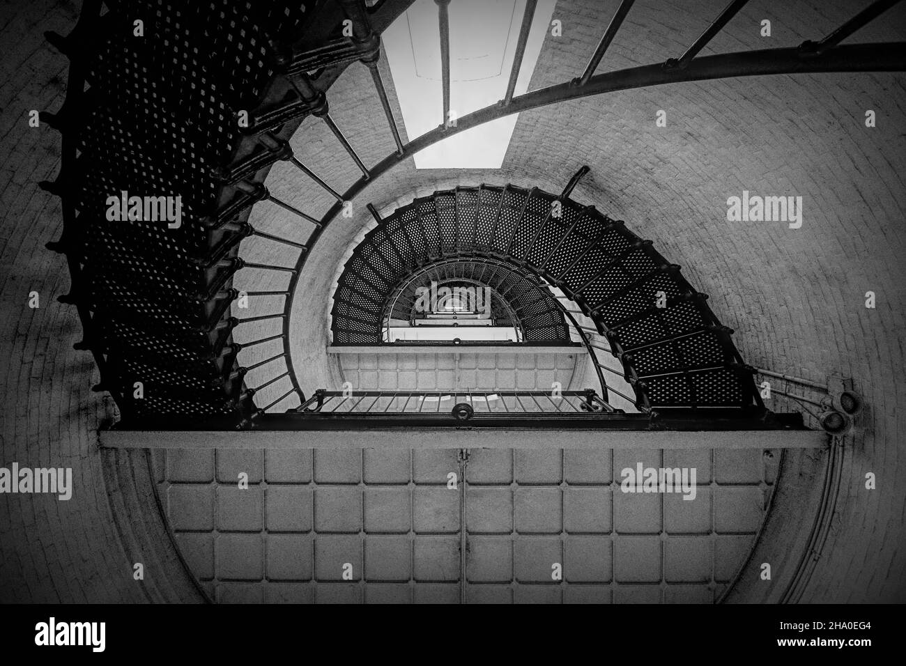 Grayscale shot of the spiral staircase Stock Photo